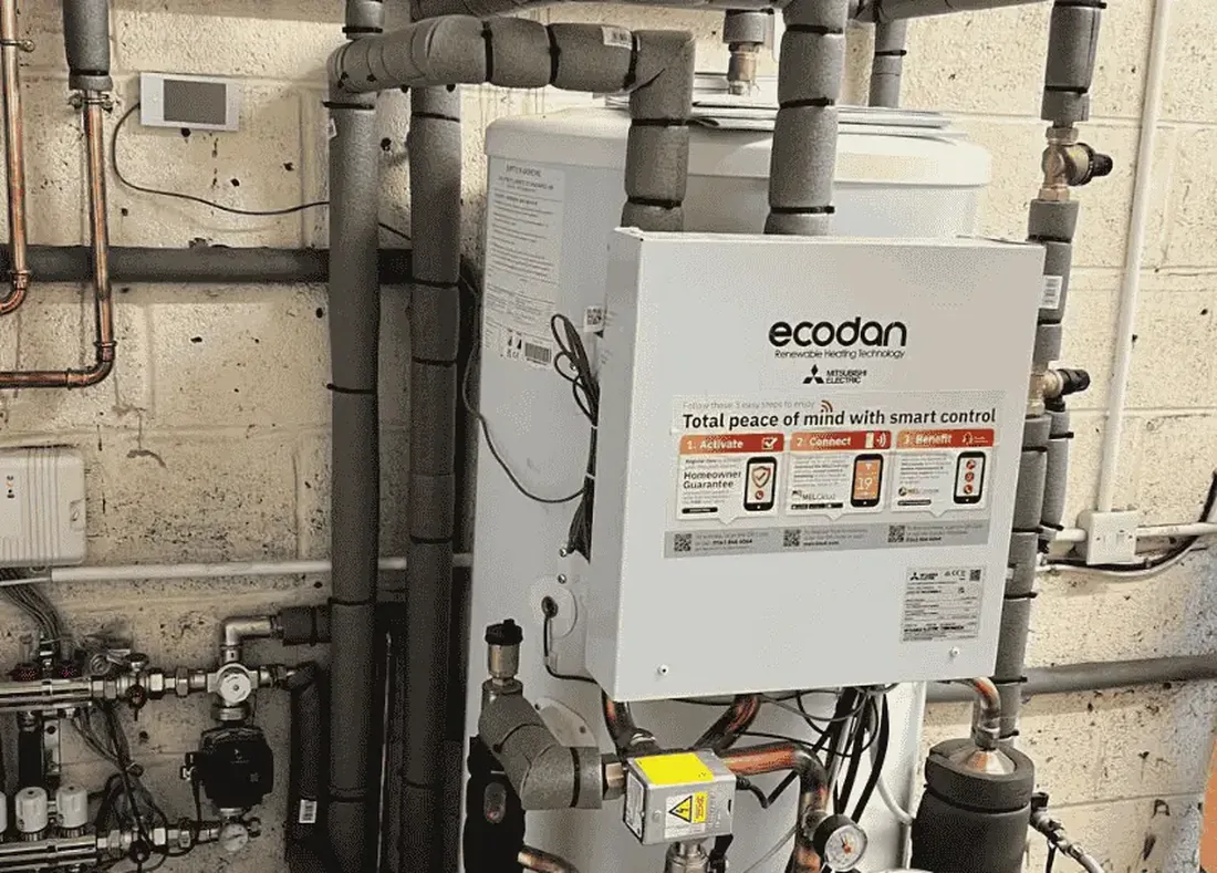Heat pump controls and cylinder pipework in a London plant space