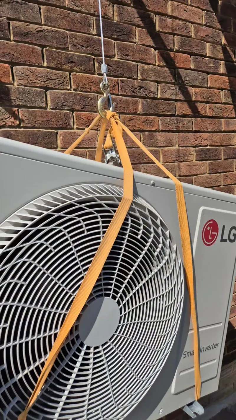 Condenser going up on straps, a job we fitted in London
