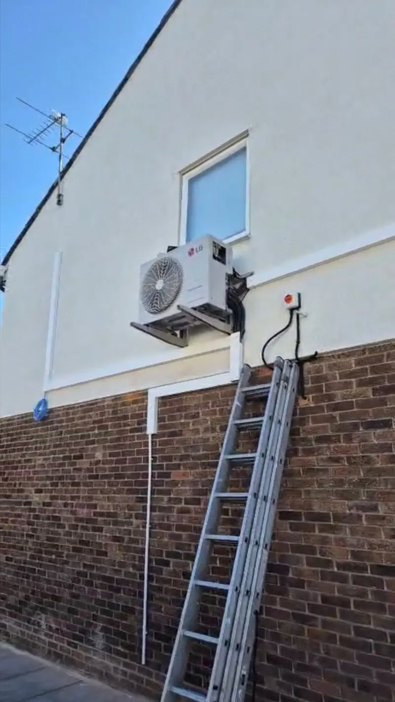Condenser high on a wall, a job we fitted in London
