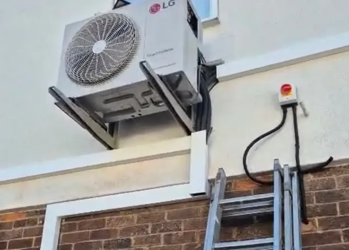 An outdoor air conditioning unit we fitted on brackets on a London rear wall